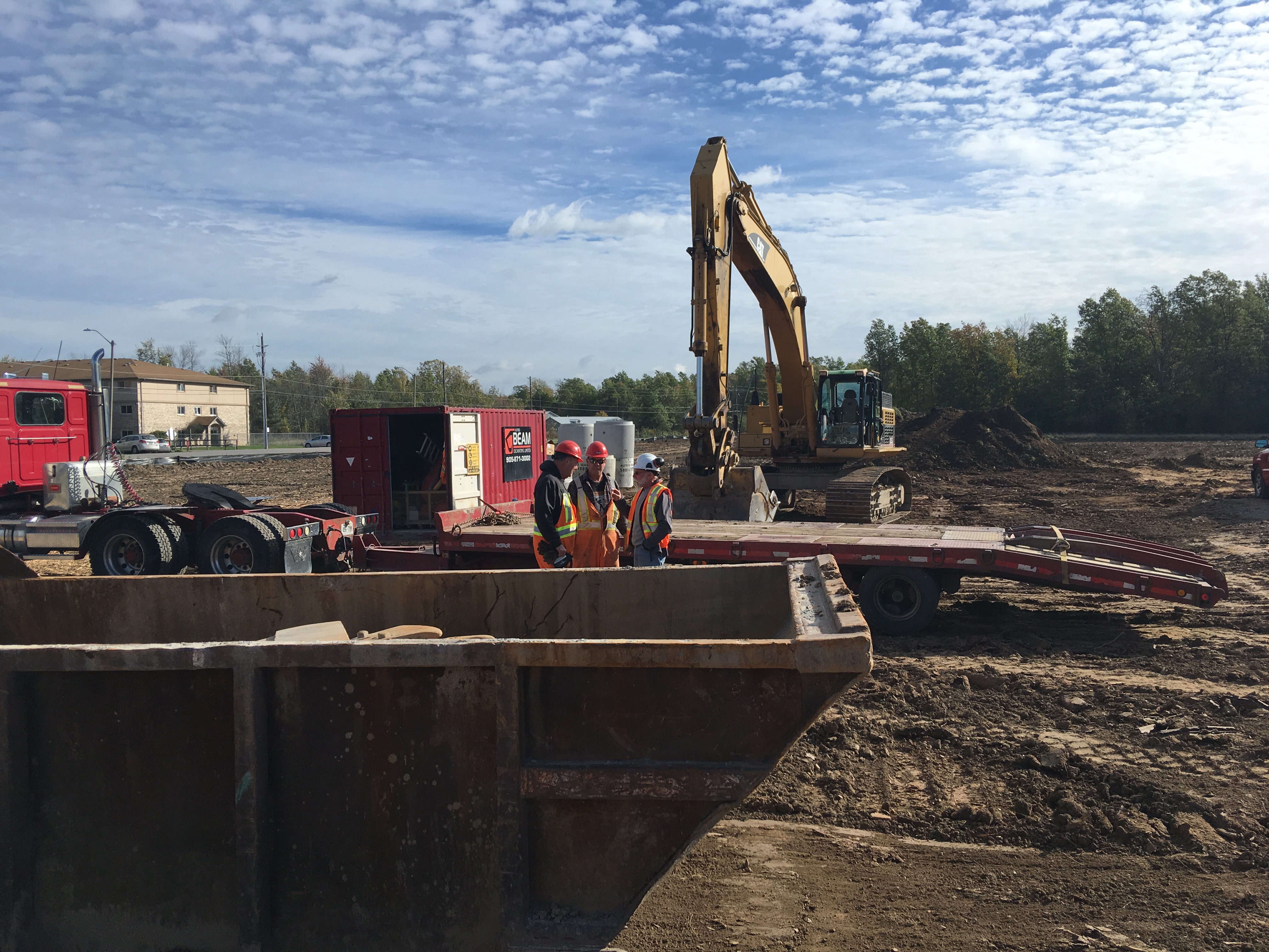 3 construction workers on a construction site