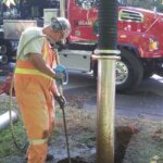Construction worker with Vacuum Truck at construction site